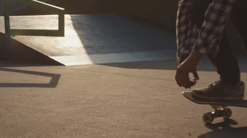 Skateboarder Doing Tricks at Skate Park