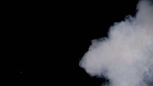 Billowing White Smoke Against Black Backdrop