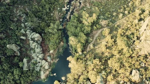 Aerial View of a River Nestled Between Rocks