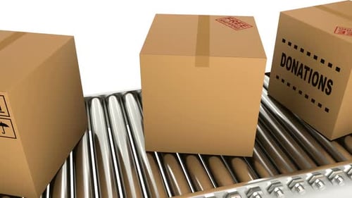 Cardboard Boxes Moving on Conveyor Belt for Shipping and Donations