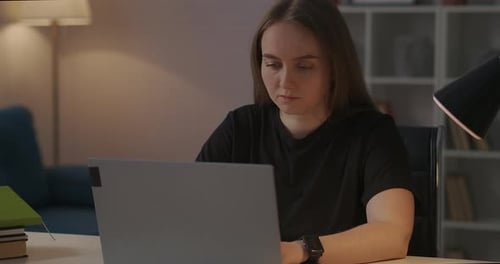Woman Works at Laptop Late at Night