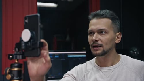 Man Talking To Camera In Recording Studio