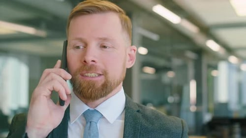 Businessman Talking on Phone in Office