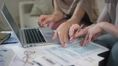 Women Doing Tax Returns Together