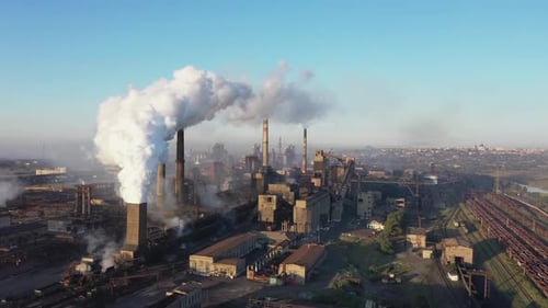 White smoke from the chimneys of a steel mill