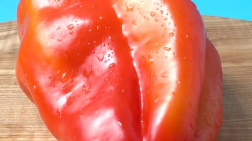 Vibrant Red Bell Pepper with Water Droplets