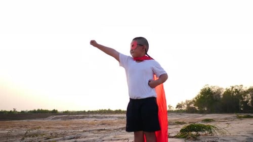 superhero boy running on the field