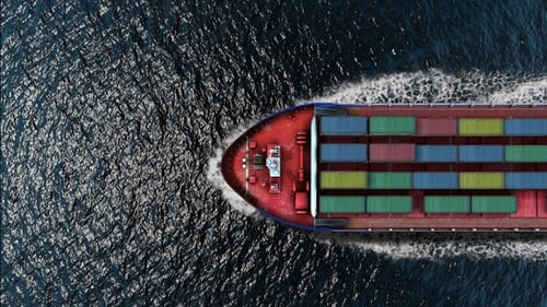 Large cargo ship carrying containers in the sea- Aerial
