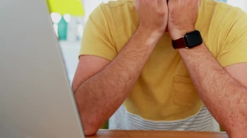 Depressed male executive sitting at desk 4k