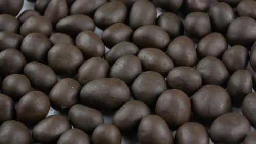 Close Up of Many Chocolate Covered Nuts