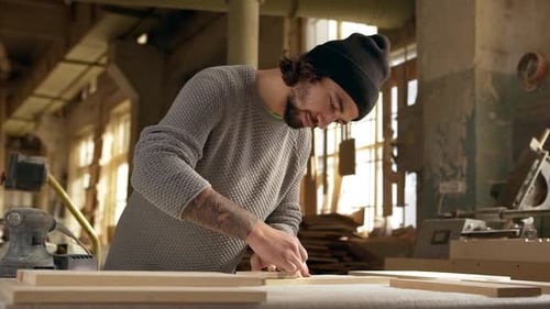 Adults Collaborating on Wood Project in Workshop