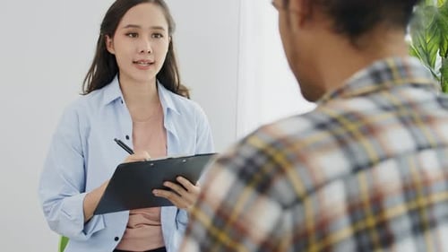 Woman Taking Notes in Office Clinic Environment