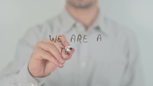 Writing "We are a Team" with a Marker