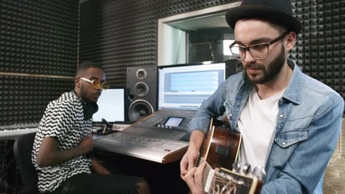 Record Producer and Musician Creating New Track