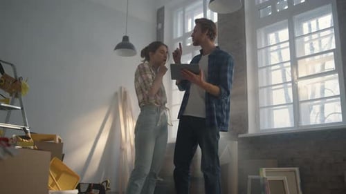 Happy Couple Discussing Design Project