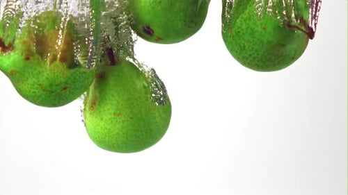 Pears Falling into Water, Creating Bubbles