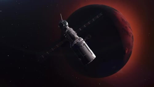 Un vaisseau spatial se déplace dans l'espace à la rencontre de la planète Mars.