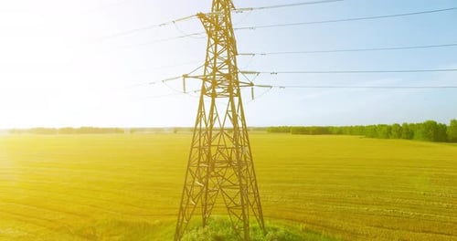 Vertical Movement Flight Near High Voltage Electricity Tower and Power Lines at Green and Yellow