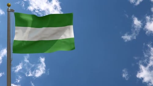 Realistic Green and White Striped Flag Waving in Blue Sky