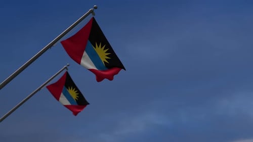 Antigua and Barbuda National Flags Waving Against a Blue Sky