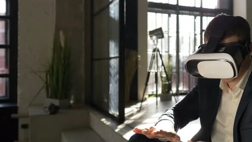Man Using VR Headset in Modern Apartment