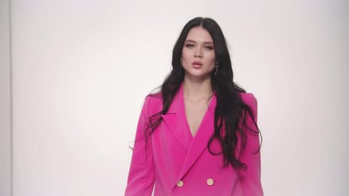 Stylish Woman in Pink Blazer Posing