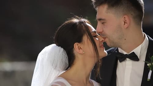 Bride and Groom Share a Kiss on Wedding Day