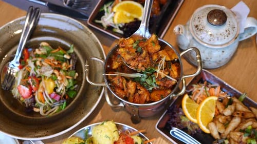 Overhead Shot of Dishes of Food on Table
