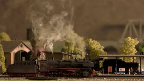 Charming Model Train Rolling Through Miniature Village