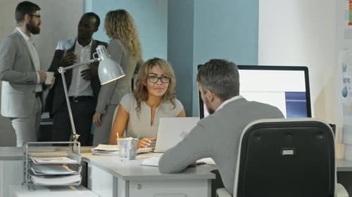 Office Workers Chatting at Work