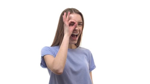 Young Adult Smiling Giving Ok Sign