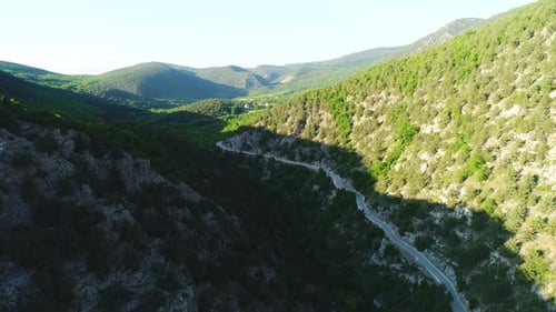 Road going through a green mountains