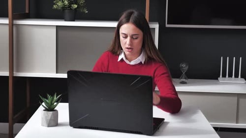 Young Woman Shocked Receiving Very Bad News on Her Laptop Computer Screen Upset and Frustrated with