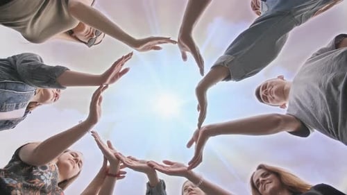 Conceptual Symbol of Cooperation Diverse Hands Making a Circle. Students Help Each Other.