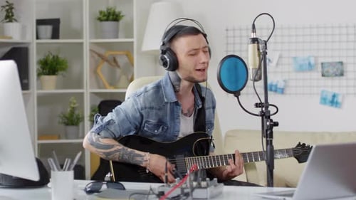 Man Recording Song in Home Studio