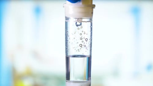 Dripping medical perfusion close up equipment in clinic background