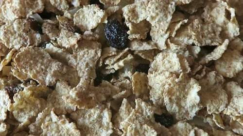 Breakfast Cereal Corn Flakes and Raisins Close Up