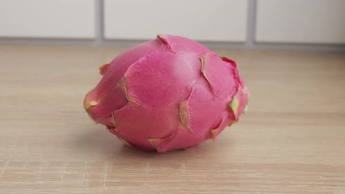 Taking Dragon Fruit From Bench