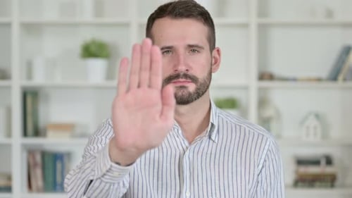 Man Points Finger After Stop Hand Gesture