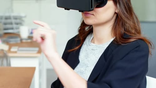 Woman Uses VR Headset with Hand Gestures in Office