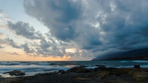 Time Lapse of Sunset above Sea. Clouds moving over Ocean. Landscape - Coast at Dusk