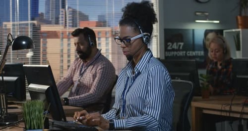 Woman Working at His Desk in a Call Center
