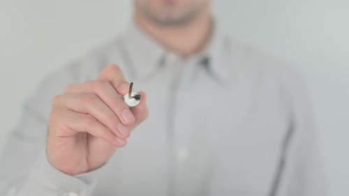 Hand Writes Effort on Clear Surface