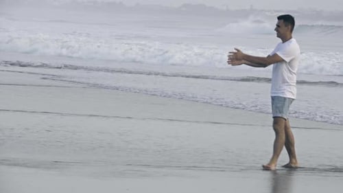 Joyous Father and Daughter Playing and Walking on Ocean Beach
