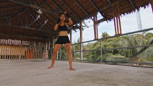 Woman Fighter Trains Her Punches Training Day in the Abandoned Hotel Strength Fit Body