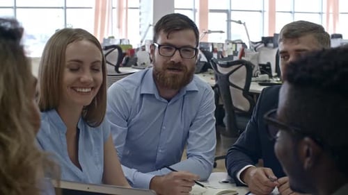 Diverse Team Collaborating at Urban Workplace Meeting