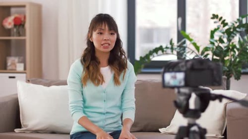 Woman Filming Video for Online Audience in Living Room