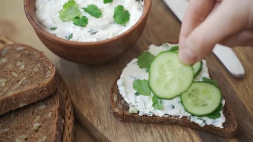 Making Cream Cheese and Cucumber Sandwich Close Up