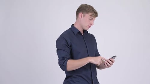 Excited Man Celebrating Good News on Smartphone