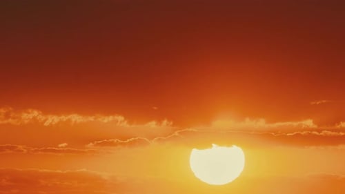 Golden Sunset with Vibrant Sky and Clouds